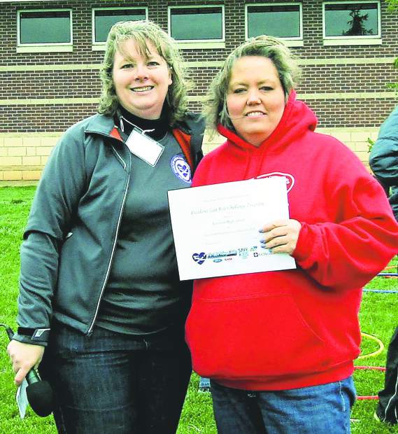 Nonprofit Alexa's Hugs pictured awarding Roosevelt High School for improved seatbelt usage during theinaugural Alexa's Hugs 5K and Family Fun Run on May 7 at Fossil Ridge High School in Fort Collins.